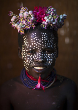 Kid With Flowers Decorations, Korcho, Omo Valley, Ethiopia by Eric Lafforgue on Flickr.