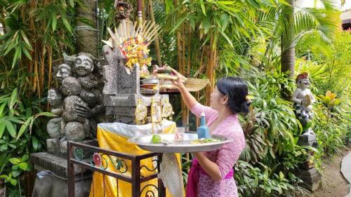 Making offerings at Shrine, Bali