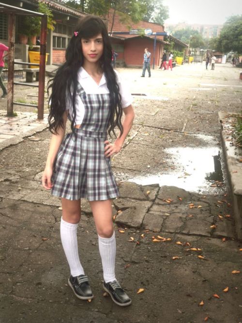 batou:  This is Kim Zuluaga. A 18 years old trans girl from my city, Medellín (Colombia). When she was seventeen, it was the first day of another year of school and she attended to it with the uniform that girls use (The bottom picture is the actual