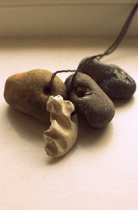Hag stones. Traditional amulets. Stones with natural holes right through them are