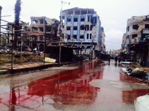 insurrectionnews:A river of human blood in Douma, Damascus, Syria following Assad regime airstrike 13/02/15. Photo via @mshinqiti 
