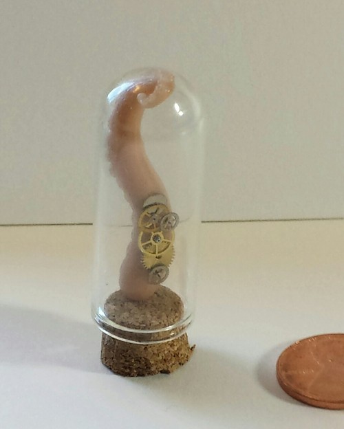 Clockwork plus polymer clay tentacles equals mad science! The tentacle is hand sculpted, Penny shown