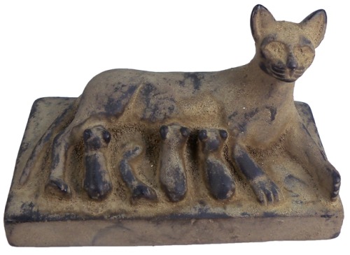 sadighgallery:Ancient Egyptian, carved black limestone laying mother cat nursing her three kittens. 