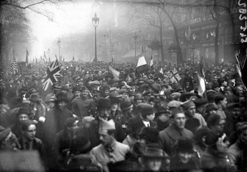 Crowds of people celebrating the signing of the Armistice and end of the Great War at November 11th 