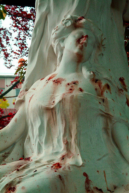 horrorlesbians:Flower petals cause blood-like stains on the grave of opera singer Jane Margyl in Bat