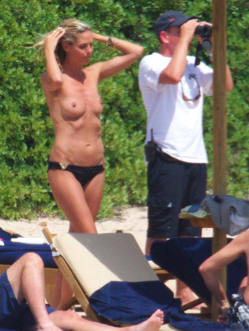 toplessbeachcelebs:  Heidi Klum (Model) sunbathing topless in Sardinia (August 2011) - Part I