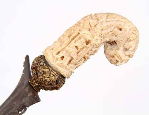 Indonesian kris with carved ivory hilt, mounted with diamonds and rubies, 19th century.from Helios A