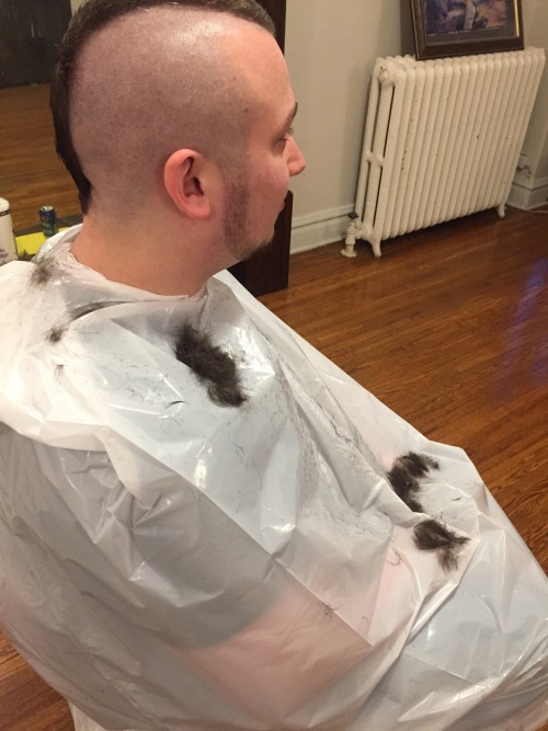 trash bag haircuts - Getting a mohawk in a white trash bag.