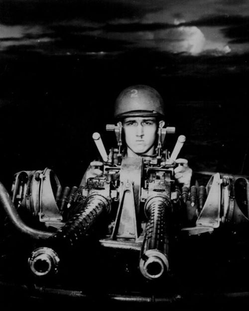 warhistoryonline:A PT boat gunner at his 50-cal machine gun, New Guinea, July 1943. http://wrhstol.c