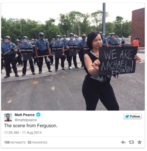 invisiblelad:  micdotcom:  Days after Michael Brown’s death, Ferguson looks like a war zone  A vigil held for Michael Brown, an unarmed black teenager gunned down by Ferguson, Mo., police on Saturday in disputed circumstances, turned into what the media