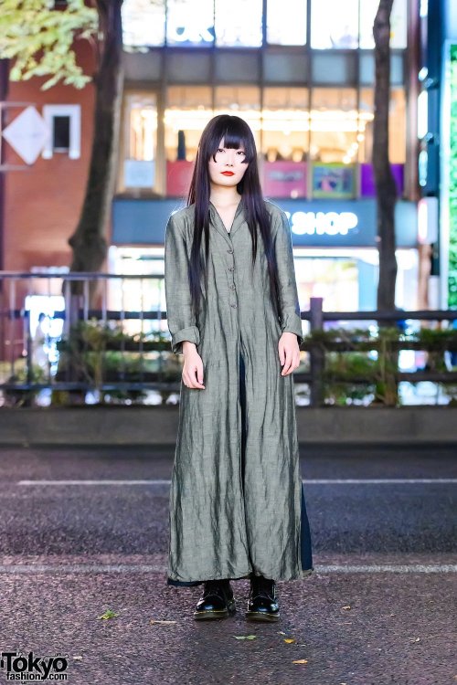 20-year-old Japanese student Kana on the street in Harajuku wearing a vintage linen maxi coat over a