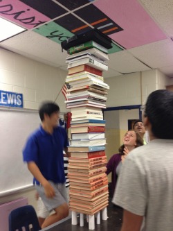 immasquiiiid:  g1az3dragnn5:  askenderdave:  holfiecat:  My friend and I were given 5 sheets of paper to support as much weight as possible. This is the result. We had to stop stacking books because the ceiling got in the way.  WHAT  Holy crap  physics