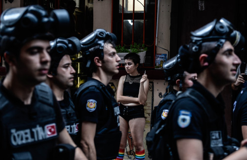 sourdoughnibblers: romantikkomunist: This photo shows a young woman in rainbow stockings standing in