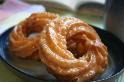 A “cruller” is a fried pastry that traditionally looked like “small, braided torpedo.” It was consid