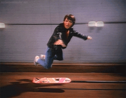 fashionandcostumedesign: Michael J Fox on a hoverboard behind the scenes of Back to the Future.