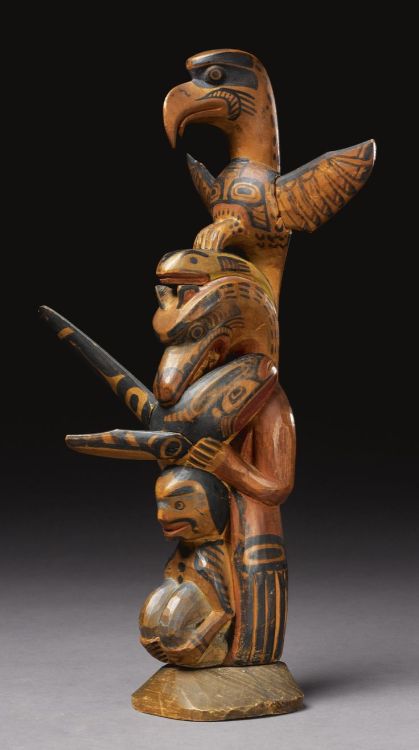 whitedogblog:Kwakiutl wooden model totem pole, carved with a human figure in a crouching posture, su