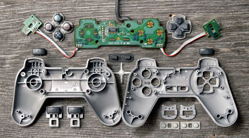 cinemagorgeous:  Many generations of game controllers, taken apart by Brandon Allen. 