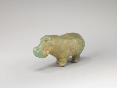 Statuette of a Hippopotamus This figure of a hippo was molded in faience, a crushed quartz glazed an