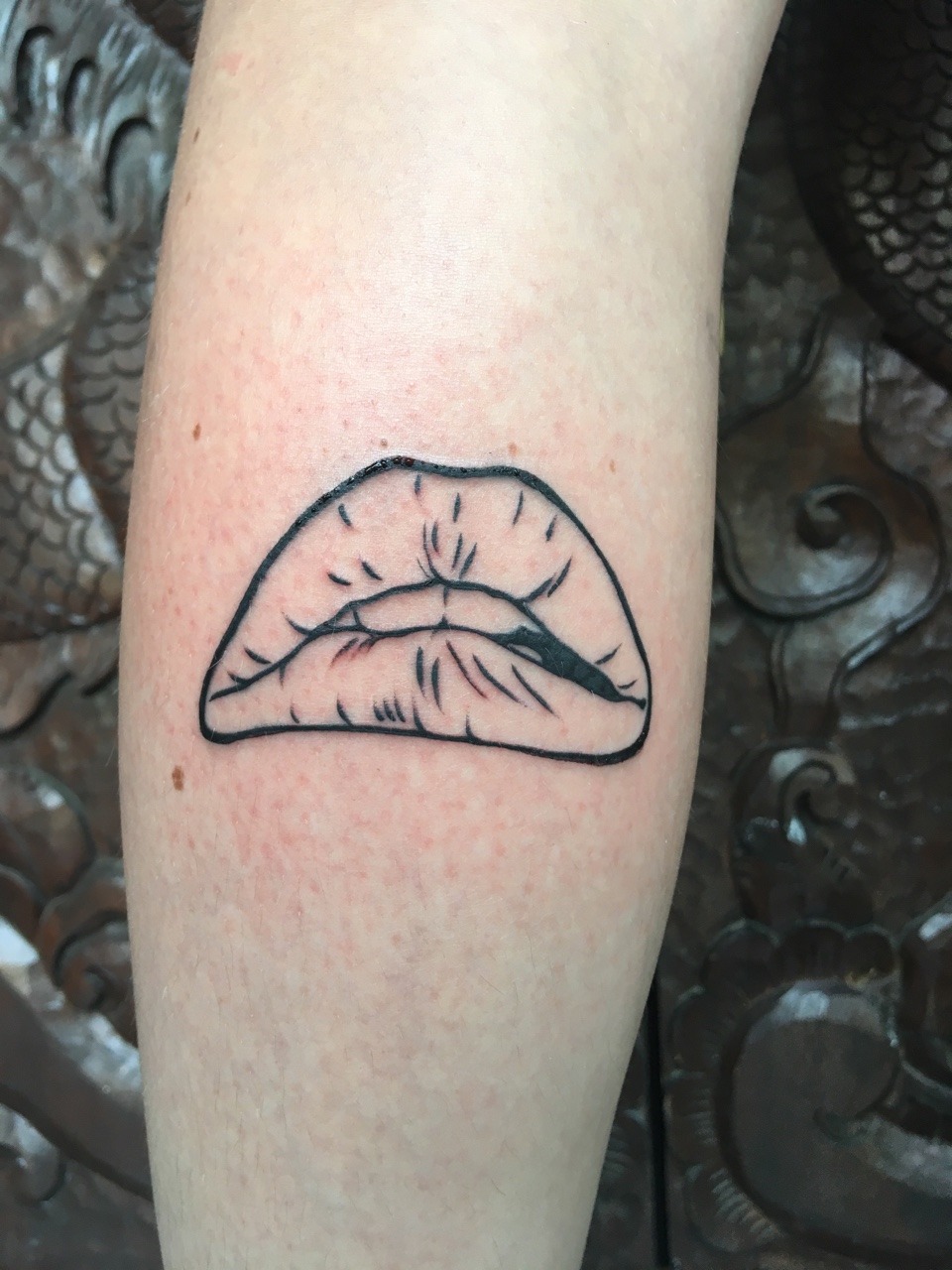 Rocky horror lips tattoo on the inner forearm