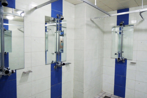 Three men’s shower rooms at Gachon University in Seongnam, South Korea.The top orange shower is in t