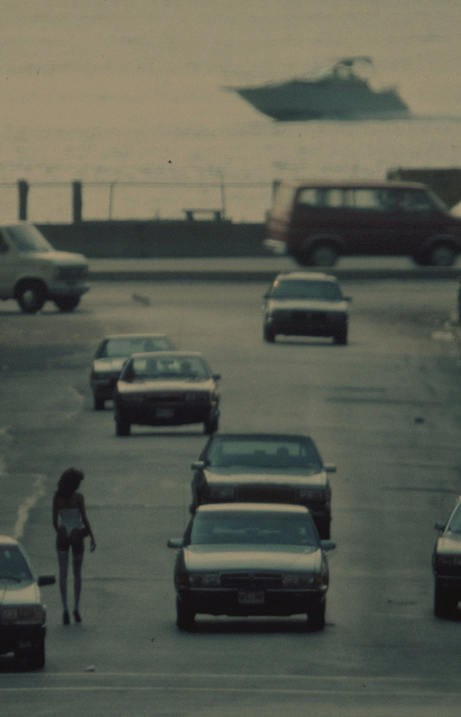 historicaltimes:  Woman walks down Eleventh Avenue and 31st Street, NYC, 1987  by