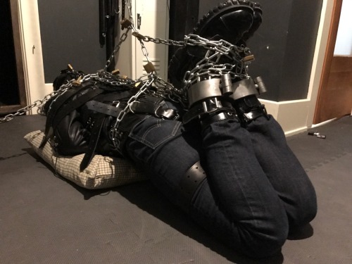 seabondagesadist: The “rest” for @lostinsea88 didn’t last all that long before I decided that it was simply not enough bondage and needed correction. A modified straightjacket hogtie was called for.  His legs pulled up and locked to chains around