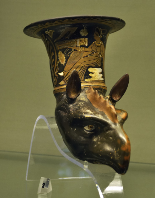 Red-figure rhyton in the shape of a griffin’s head.  Unknown Apulian artist, ca. 330 BCE.  Now in th