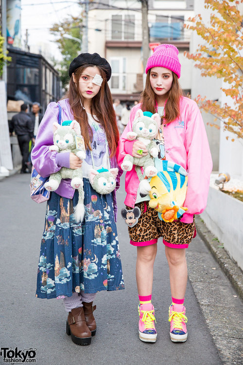 Japanese sisters Yurika and Mizuho on the street in Harajuku carrying plush Gelatoni cats and wearin