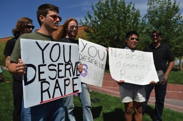 kingofdoma:  damseling:  TRIGGER WARNING: RAPE The asshole holding the sign that