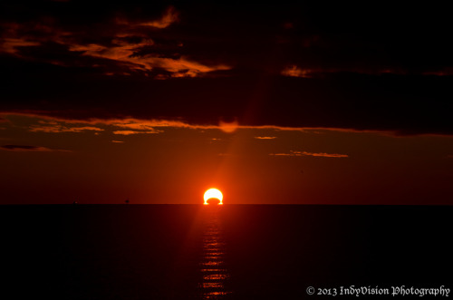 kenobi-wan-obi:  An Omega Sunrise Eclipse     The November 3rd sunrise eclipse over the Chesapeake Bay, from Chesapeake Beach in Maryland. These are stills from a time-lapse sequence I shot of the eclipsed sunrise. - Indy 