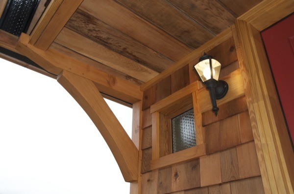 riddick09:  The Acorn tiny house is 14′ by 8.5′ with a covered front porch and