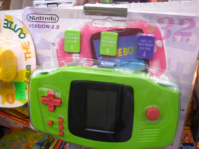 Nintando Version 2.0 handheld, featuring 32-bit graphics, a wide color screen, and faux speakers.
According to my wife, the above system was spotted by America’s Next Top Model (Cycle 1) contestant Elyse Sewell while in China, where she now works,...