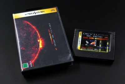 Devil Blade 2 Saturn cartridge. Yes, cartridge. The Saturn Junkyard’s elend liked this game, made by Shigatake in the shmup construction program Dezaemon 2 so much that he decided to dedicate a Saturn memory unit to it, putting the card inside a Mega...