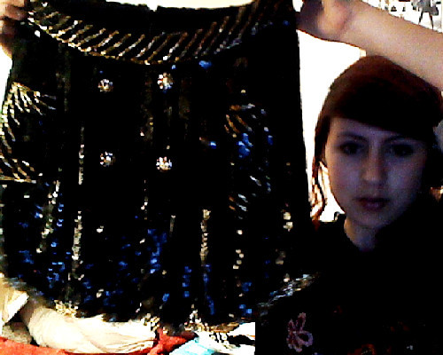 frenchiejane:  ignore my face but how PRETTY is my new skirt! i bought it on the topshop online sale and it finally arrived today. it is sequinned all over and all swishy. i can’t wait to wear it to school tomorrow!   ohmigosh i wanted that you lucky