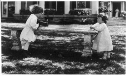 whoisemmaa:  breathingvioletfog:  liquidnight:  Frances Benjamin Johnston - One child aiming camera, on bench, at another child, Washington, DC, circa 1890-1910 [From The Library of Congress]   this is absolutely adorable  