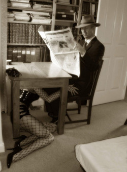sweetsurrenders: psychespet:  scandalouswench:  everything about this is perfect. suit, newspaper, bored expression, desk, blowjob, fetishwear. naggisch:  (via sexual)     L