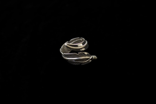 Self Edge Feather Ring:The Feather Ring starts out as sheet silver and is first cut to the shapeof t