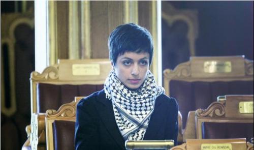 DAMN.(Member of the Norweigian parliament wears a keffiyeh to show sympathy and solidarity with Gaza