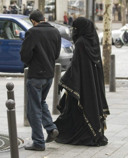 Muslim women at the beach in burkas