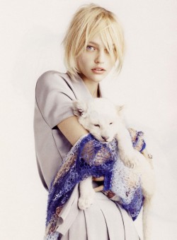 Sasha Pivovarova holding a Rodarte sweater in Vogue Paris by Mark Segal