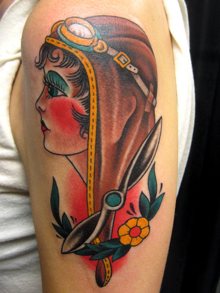fuckyeahtattoos:  Owen Jensen aviatrix flash personalized with propeller and filigree.