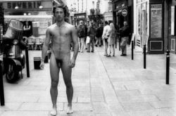 Naked on the sidewalk.