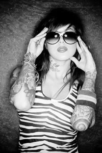 shamelessshouting:  Kat Von D.  I&rsquo;ve been watching L.A. Ink alot lately. I like her, shes cool. anywayz, i want tattoos, sooooo frickin&rsquo; bad. :( i CANNOT wait til im 18! &lt;3