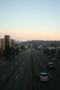 okcipitalsofresh:  &ldquo;I know there’s a big world out there like the one that I saw on the screen. In my living room late last night it was almost too bright to see.&rdquo; - Seattle, on a bridge overlooking WA-99.