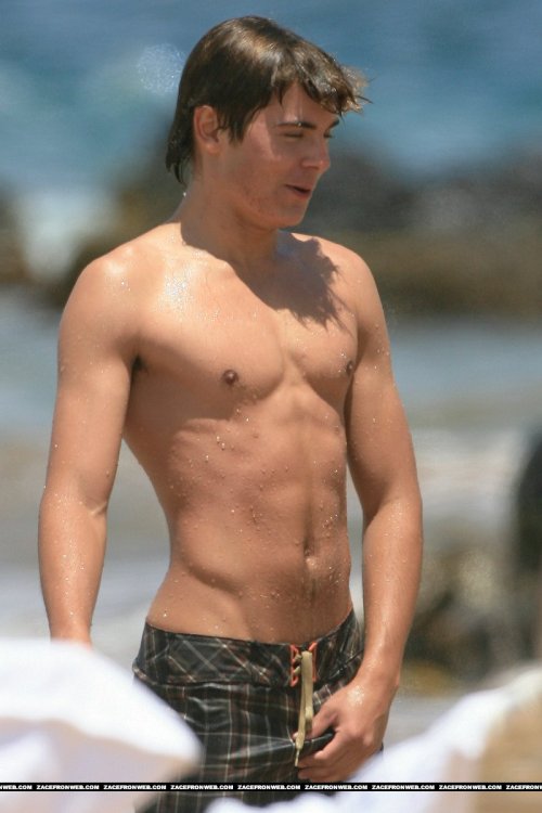 Porn Pics Zac Efron adjusting his junk.