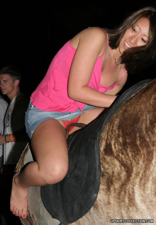 upskirtbabes2:  Up her skirt while she rides the mechanical bull … 