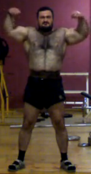 Screen Cap Of A Furry As Hell Powerlifter. Flexing. Click The Screen Cap To See The