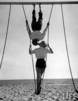 liquidnight:Allan GrantSwingersAcrobat and actor, Russ Tamblyn on the beach with movie actress Venetia Stevenson, Venice Beach, California, August 1955[From the LIFE magazine Photo Archive]