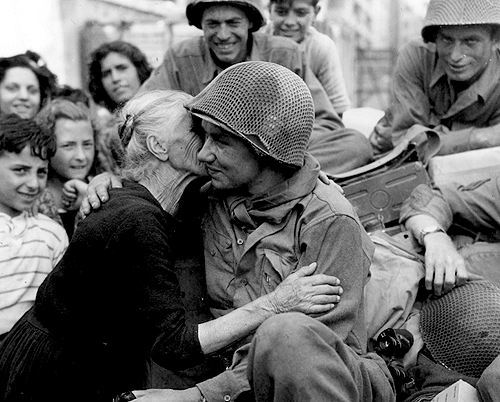 PFC Elmer Sittion being kissed by an overjoyed Italian woman upon his arrival to Rome. Fifth Ar