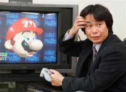 fuckyeanintendo:   I don’t know why, but there is something hilarious about this picture to me.   In this Feb. 6, 1997 file photo, Shigeru  Miyamoto, creator of Super Mario video game series, demonstrates Super  Mario 64 in his office at the Nintendo